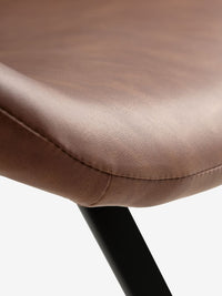 Silla de comedor HYGUM giratoria polipiel marrón/negro